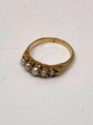 A yellow gold pearl set ring, marked rubbed, size N. CONDITION REPORT: 3.