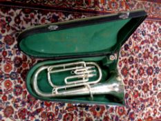 A silver plated tenor horn with mouthpiece in case