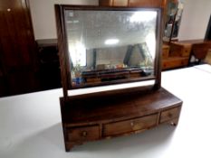 A George III mahogany dressing table mirror fitted with three drawers