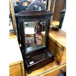 An Edwardian mahogany mirror with storage compartment,
