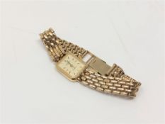 A lady's 9ct gold Rotary quartz wristwatch on 9ct gold integral bracelet.