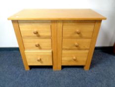 A contemporary oak six drawer chest,
