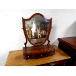 A 19th century inlaid mahogany shield shaped dressing table mirror