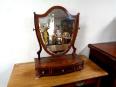 A 19th century inlaid mahogany shield shaped dressing table mirror