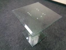 A contemporary all glass occasional table,