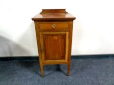 An Edwardian inlaid mahogany pot cupboard fitted with a drawer,