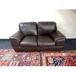 A leather two seater settee,