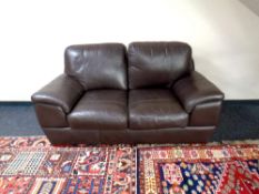 A leather two seater settee,