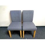 A pair of contemporary grey upholstered dining chairs