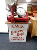 A 20th century Berkel and Parnall meat slicer standing on white marble base with pine top,