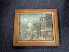 A continental oil painting depicting figures by buildings, signed Garber,