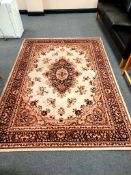 A machine made rug of Persian design,