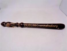 A wooden truncheon with later decoration