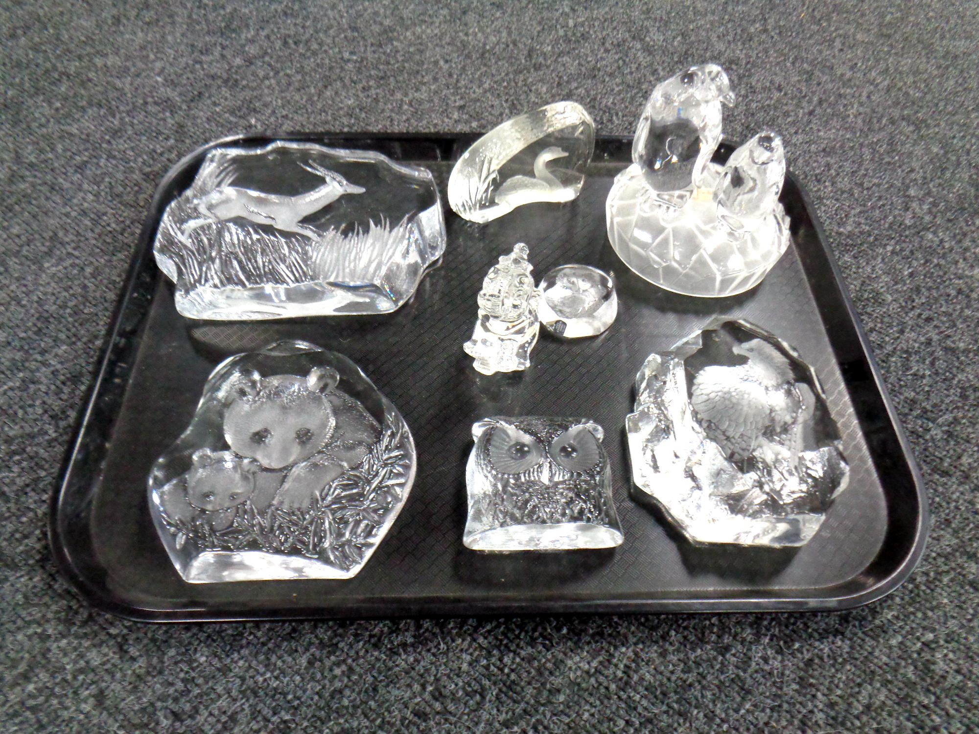 A collection of glass paperweights and ornaments,
