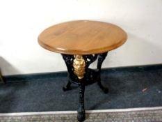 A Britannia metal based bar table with oak top