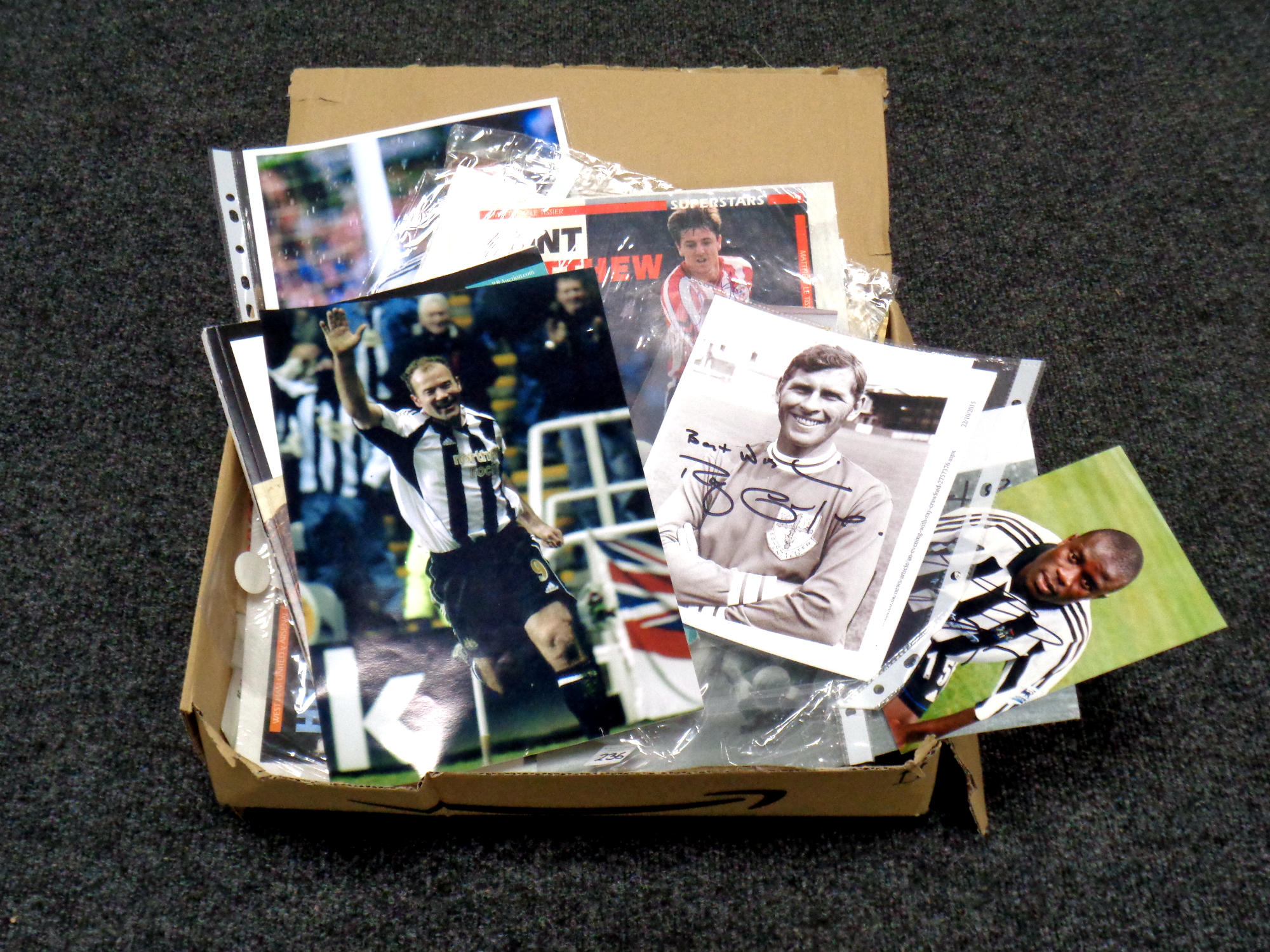 A large quantity of signed football ephemera, signed photographs,