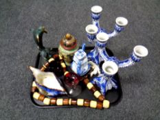 A tray of blue and white candlesticks, beaded necklace,