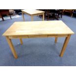 A contemporary oak office table fitted three drawers,