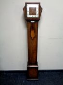 An Art Deco oak cased grandmother clock,