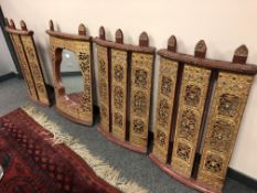 Four antique Burmese hardwood panels with gilded and painted decoration,