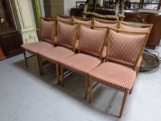 A set of eight continental dining chairs upholstered in a striped fabric
