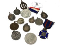 A collection of silver and other medals,