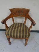 An early 20th century carved mahogany dining chair