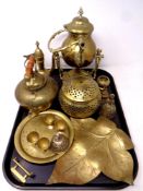 A tray containing assorted brass wares to include eastern teapot, spirit kettle on stand,