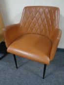 A Danform leather armchair on metal legs