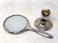 A silver hand mirror together with a silver captstan inkwell, Birmingham 1919.