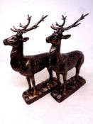 A pair of cast iron deer figures