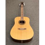 An SX Custom Guitars six-string acoustic guitar, model number DG50, serial number 8400390,