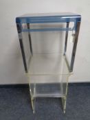 A clear perspex magazine table together with a further perspex occasional table on metal legs