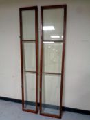 Two mahogany and glass bookcase doors
