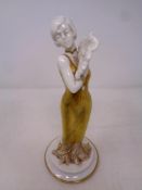 A Capodimonte gilded Art Deco figure,