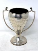 A Chinese silver twin handled trophy cup awarded to the civil service cricket club 1923,