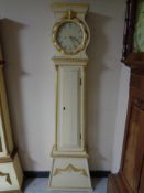 A continental painted longcase clock with circular dial