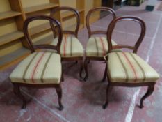 A set of four mahogany dining chairs on cabriole legs