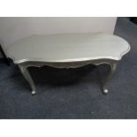 A painted French coffee table on cabriole legs