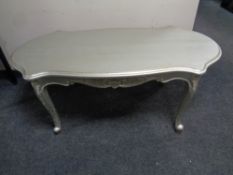 A painted French coffee table on cabriole legs