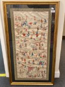 A Japanese silk embroidered panel showing a garden scene with multiple figures and a pagoda,