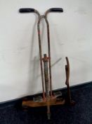 A vintage pogo stick and scooter