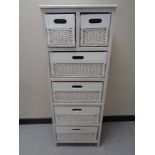 A wood and wicker six drawer chest