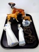 A tray containing ceramic dog figures, three Nao figures,