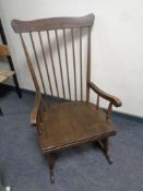 A spindle back rocking chair
