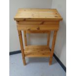 A pine clerk's desk on raised legs