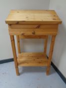 A pine clerk's desk on raised legs