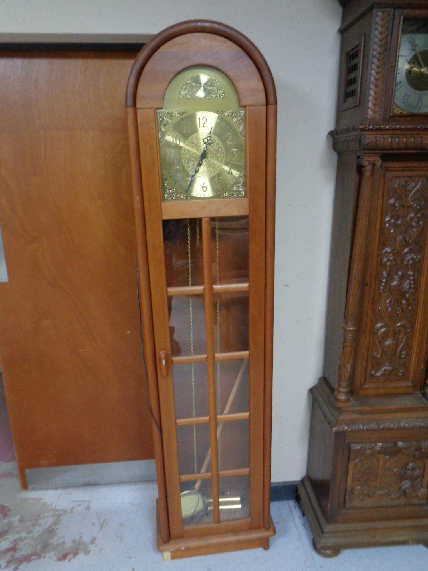 A pine cased Tempus Fugit regulator clock with brass dial