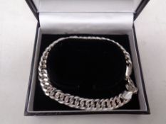 A silver curb bracelet in box