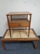 A mid 20th century teak two tier occasional table fitted a drawer together with a further tile
